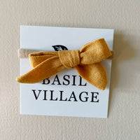 Basil Village Mustard Yellow Bow Mini 2x1 sewn bow on large doll headband
