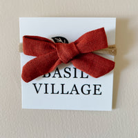 Basil Village Burnt Orange Bow Mini 2x1 sewn bow on large doll headband