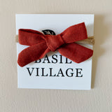 Basil Village Burnt Orange Bow Mini 2x1 sewn bow on large doll headband