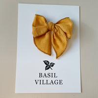 Basil Village Mustard Yellow Bow Small 3x3 serged hem bow on clip