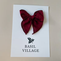 Basil Village Cranberry Bow Small 3x3 serged hem bow on clip