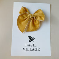 Basil Village Yellow Bow Small 3x3 serged hem bow on clip